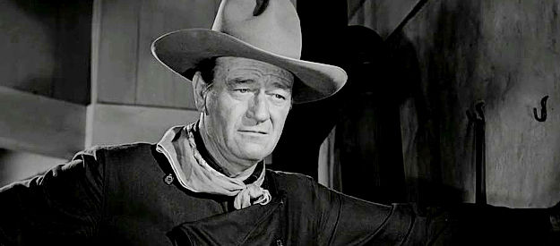 John Wayne as Tom Doniphon, the man who finds Stoddard wounded on the road to Shinbone in The Man Who Shot Liberty Valance (1962)