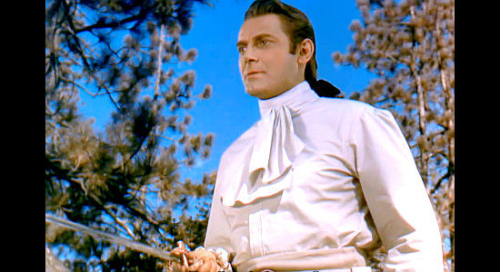 Jon Hall at Maj. Duncan Heyward, with an Iroquis Indian at the tip of his sword in Last of the Redmen (1947)