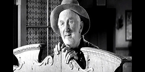 Joseph Hamilton as Abilene, the town drunk who hangs out in the saloon with the four young bullies in The Plunderers (1960)