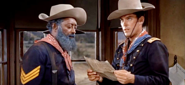 Juano Hernandez as Sgt. Skidmore and Jeffrey Hunter as Lt. Tom Cantrell, finding Rutledge's freedom papers among his belongings in Sergeant Rutledge (1960)