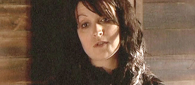 Julie Patterson, wife of the sheriff, mistress of the deputy in The Legend of God's Gun (2007)