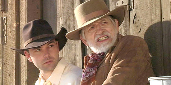 Justin Kreinbrink as John Cooper and William Killian as Sheriff Hingle, facing trouble in the mercantile in The Decoy (2006)