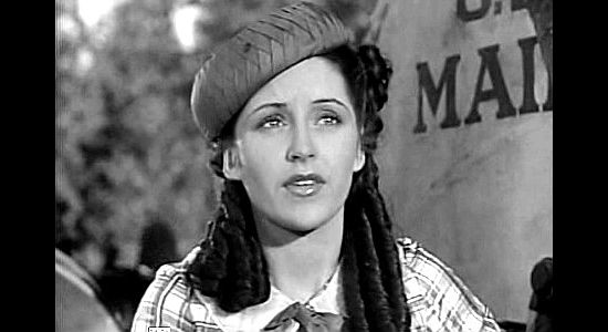 Kay Hughes as Louise, heading West to meet the man she's to marry when Murietta's gang attacks her stage in Robin Hood of El Dorado (1936)