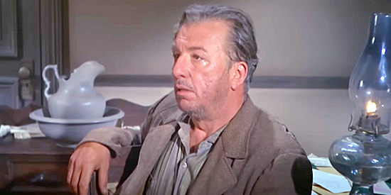 Ken Lynch as Hodges, being questioned about a murder supposedly committed by an Apache in Apache Rifles (1964)