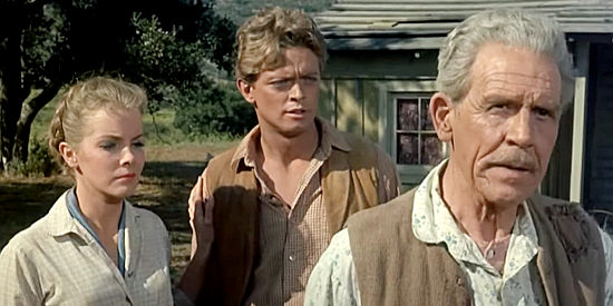 Kenneth MacDonald as Harry Malone, balking at leaving his home while children Ellen (Laraine Stephens) and Mike (Michael Blodgett) look on in 40 Guns to Apache Pass (1967)