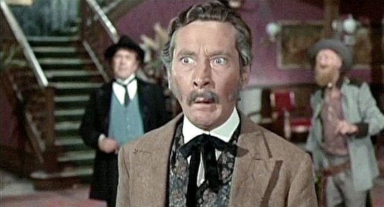 Kenneth Williams as Judge Burke, a mayor desperately seeking someone to deal with The Rumpo Kid in Carry On Cowboy (1966)