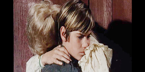 Kevin Brodie as Charlie Cole, consoling his mother after another family argument over how to deal with grizzly named Satan in The Night of the Grizzly (1966)