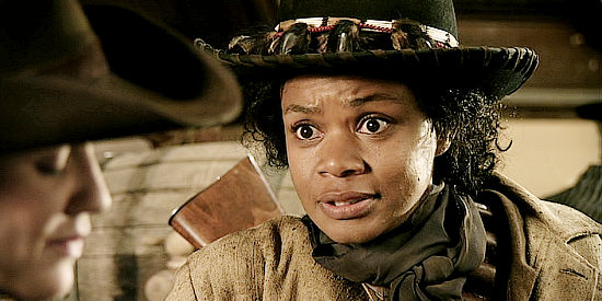 Kimberly Elise as Stagecoach Mary, trying to convince Hannah to accept a date with Wyatt in Hannah's Law (2012)