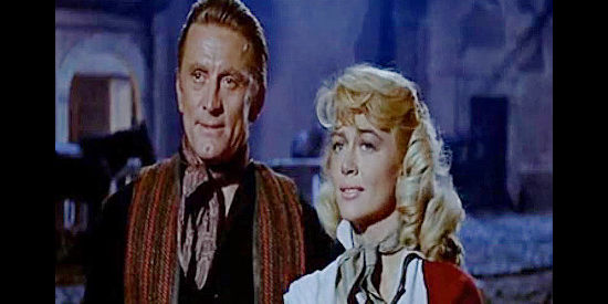 Kirk Douglas as Brendan O'Mally and Dorothy Malone as Belle Breckenridge, reunited after years apart in The Last Sunset (1961)