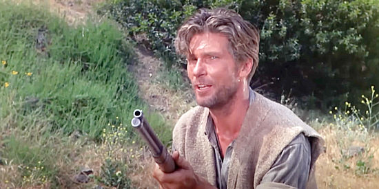 L.Q. Jones as Mike Greer, one of the miners stirring up trouble in Apache Rifles (1964)