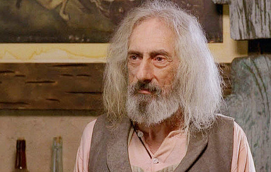 Larry Hankin as Toothless, the shopkeeper who tries to buy Elizabeth in Hard Ground (2003)