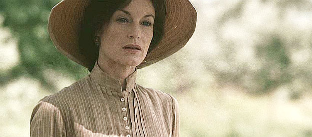 Laura Leighton as Gertrude Spacks, who watches her beau and son ride off in search of the missing in The Burrowers (2008)