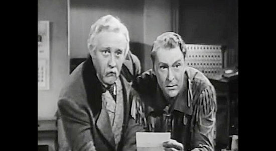 Lee J. Cobb as Jeptha Marr and Albert Dekker as Gideon Skene, receiving a letter indicating Marr's daughter Vinnie is returning from the East in Buckskin Frontier (1943)