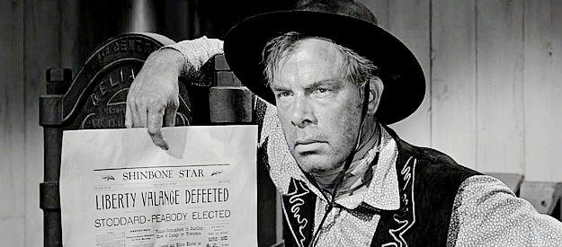 Lee Marvin as Liberty Valance, upset over an item published in Peabody's newspaper in The Man Who Shot Liberty Valance (1962)