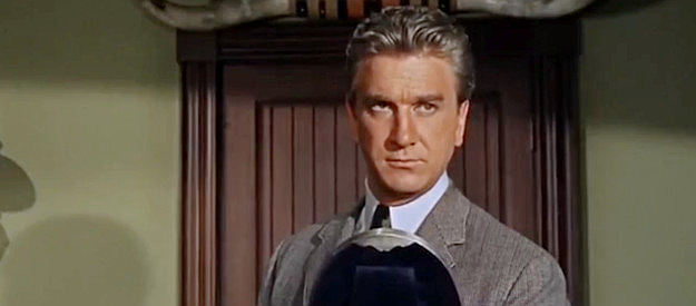 Leslie Nielson as Grant Evers, wondering if Cal Wayne's return will affect his plans to marry Cal's old flame in Gunfight in Abilene (1967)