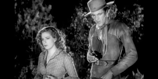 Lili Damita as Felice and Gary Cooper as Clint Belmet, considering whether they have a future together in Fighting Caravans (1931)
