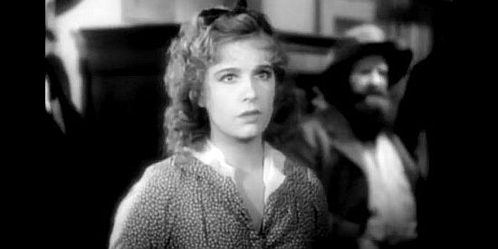 Lili Damita as Felice, concerned that Clint Belmet will hang and she'll lose her passage to California if she doesn't pretend to be his new bride in Fighting Caravans (1931)