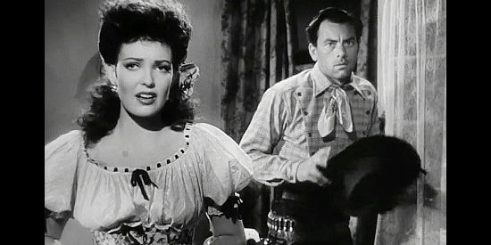 Linda Darnell as Chihuahua, rushing Billy Clanton (John Ireland) out of her room when Doc Holliday returns unexpectantly in My Darling Clementine (1946)
