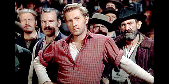 Lloyd Bridges as Johnny Steele, prosecuting the case against George Camrose in Canyon Passage (1946)