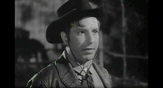 Lloyd Nolan as Trigger Bill Folliard, an outlaw forever trying to toughen up his younger brother in Apache Trail (1942)