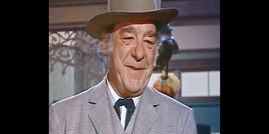 Lon Chaney Jr. as Gus Kile, the businessman behind efforts to lure the railroad from Lark in Black Spurs (1965)