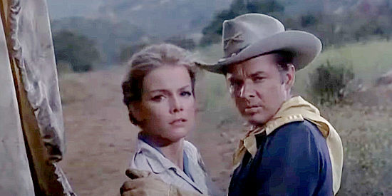 Loraine Stephens as Ellen Malone, startled by a noise in the night, with Audie Murphy as Capt. Coburn in 40 Guns to Apache Pass (1967)