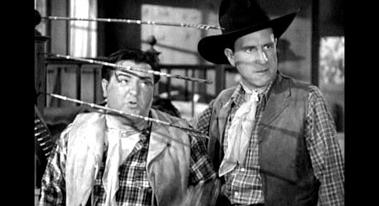Lou Costello as Willoughby, feigning bravery in the face of Indian threats with buddy Duke (Bud Abbott) in Ride 'Em Cowboy (1942)