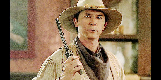 Lou Diamond Phillips as Bobby Hattaway, getting a rude reception from Croaker's henchmen in Lone Rider (2008)