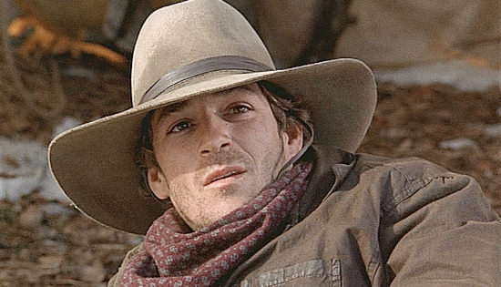Luke Perry as Harry Hammett, caught branding a stolen calf in Johnson County War (2004)