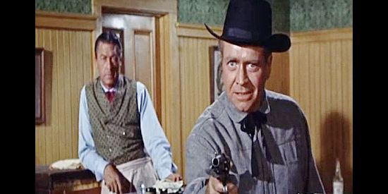 Lyle Bettger as Mayor Jess Yates, threatening saloon owner Nona Williams in Johnny Reno (1966)