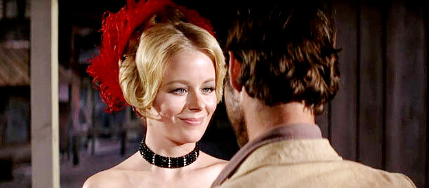 Lynn Kellog as Marcie, a saloon girl fending off the advances of Billy Roy Hackett in Charro! (1969)