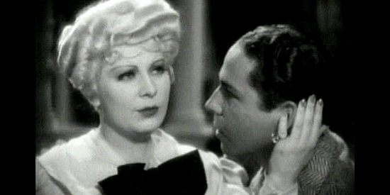 Mae West as Ruby Carter being romanced by Roger Pryor as Tiger Kid in Belle of the Nineties (1934)