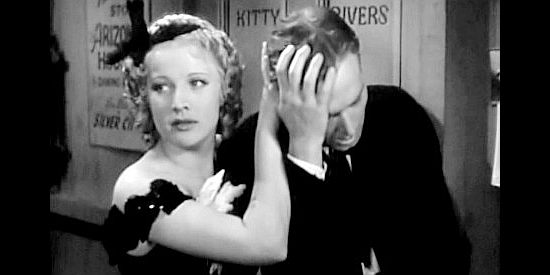 Margot Grahame as Kitty Rivers, coming to the aid of boyfriend Orin Tallant (James Bush) after a run-in with Mannon's men in The Arizonian (1935)