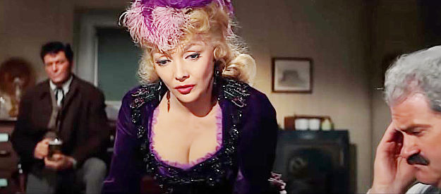Mari Blanchard as Camille Reedbottom, the saloon girl who arouses Katherine McLintock's jealousy in McLintock! (1963)