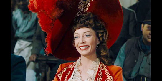 Marie Windsor as LaBelle Bergere, the latest beauty to grace Blackie's arm in The Beautiful Blonde from Bashful Bend (1949)