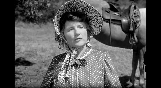Marjorie Main as Widow Hawkins, keeping a close eye on the man she hopes to marry in The Wistful Widow of Wagon Gap (1947)