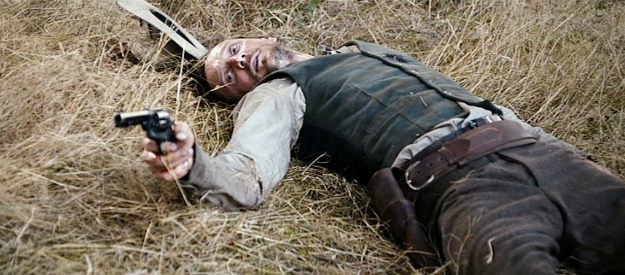 Mark Mandic as Carl Boehmer, wounded but still able to defend himself in Gold (2013)