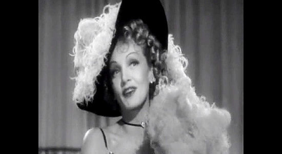 Marlene Dietrich as Frenchy, entertaining the men at the Bottleneck saloon with a little song and dance in Destry Rides Again (1939)