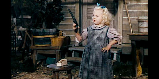Mary Monica McDonald as young Freddie, practicing her six-gun skills with her grandpa in The Beautiful Blonde from Bashful Bend (1949)