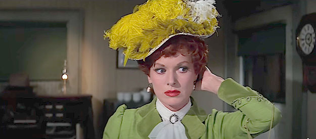 Maureen O'Hara as Katherine McLintock, worrying that her hat is on straight in McLintock! (1963)