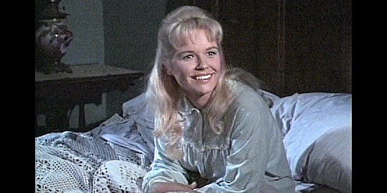 Melinda Plowman as Betty Bentley, humored by Eva's suggestions on how to keep away vampires in Billy the Kid vs. Dracula (1965)