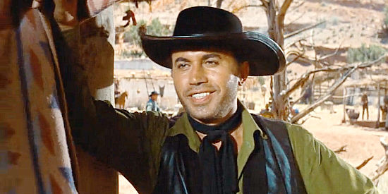 Michael Ansara as Amelung, enjoying the prospect of watching Paul Regret die in The Comancheros (1961)