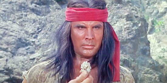 Michael Dante as Red Hawk, bound and tortured by whites over a gold nugget in Apache Rifles (1964)