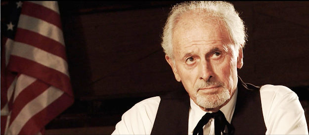 Michael Forest as Judge Hanchett, finding Print innocent in the death of a rustler in The Scarlet Worm (2011)