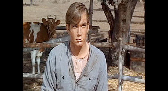 Michael Larrain as Jim Colby, a homesteader's son who wants to help Chaddock destroy a dam in Buckskin (1968)