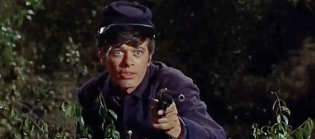 Michael Sarrazin as Cord Decker, returning from the war and worried about who's approaching his campfire in Gunfight in Abilene (1967)