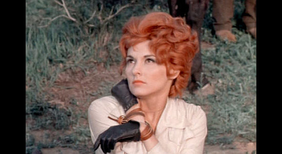 Nancy Kovack as Rose Sharon, struggling after being tied up by Johnny Silver in The Wild Westerners (1962)