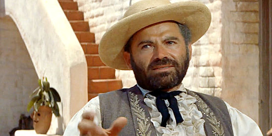 Nehemiah Persoff as Graile, leader of the comancheros in The Comancheros (1961)