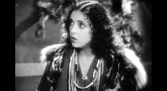 Nina Quartero as Woolie-Woolie, the dark-haired beauty jealous over La Bey's fascination with Nedra Ruskin in Men of the North (1930)
