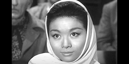 Nobu McCarthy as Kim Sung, attending a church where she really isn't welcome in Walk Like a Dragon (1960)